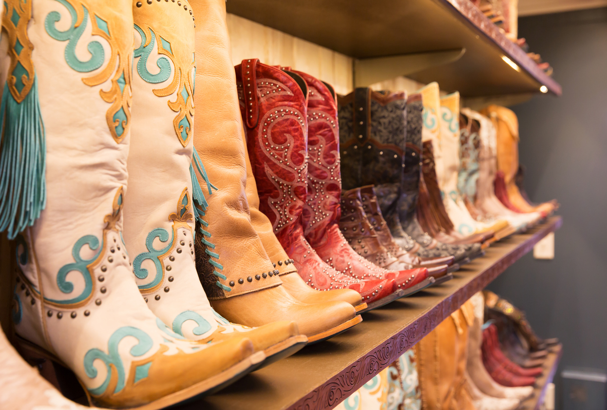 cowboy boots on a shelf in a store