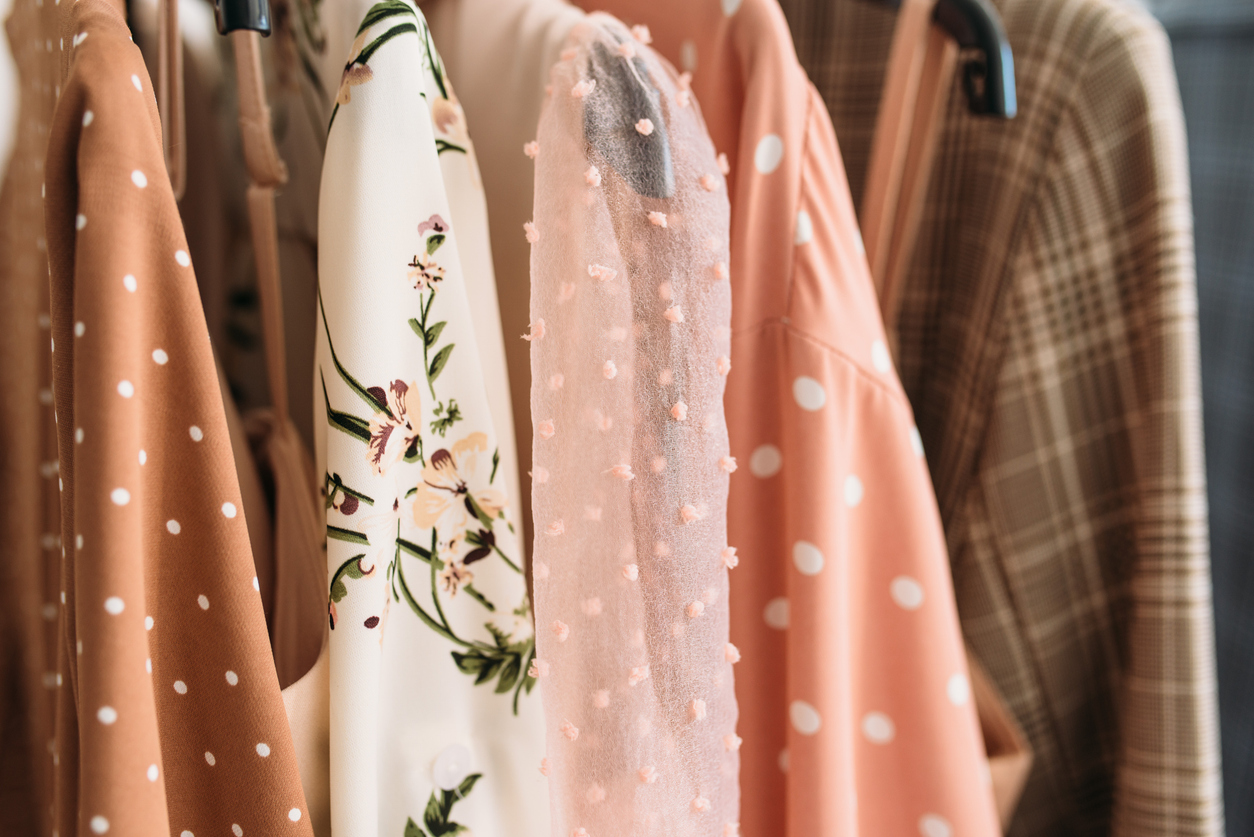 clothes on a rack in a boutique