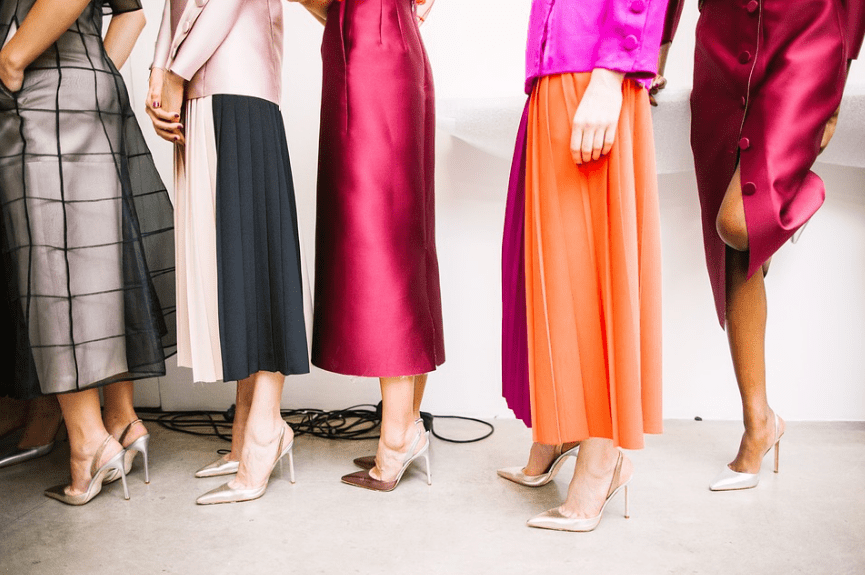 women on a line, wearing high-heels