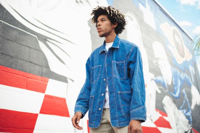 person wearing a denim jacket