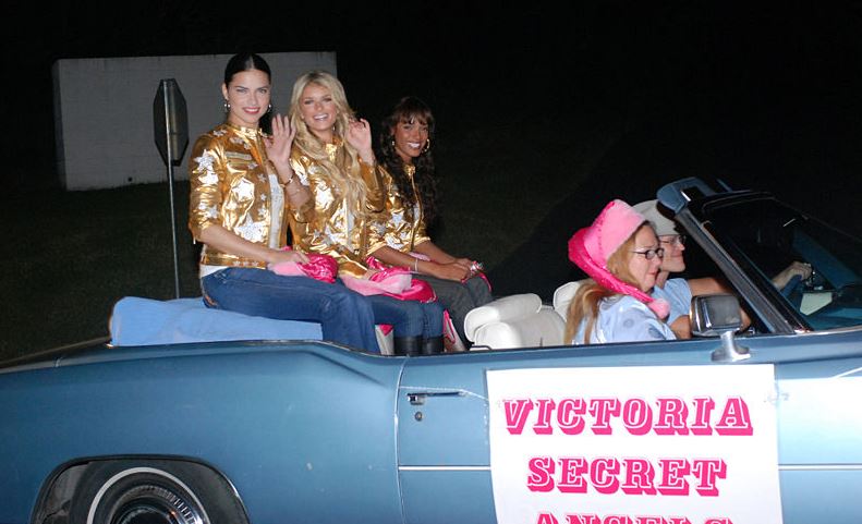 Victoria's Secret Angels Lima, Marisa Miller and Selita Ebanks riding a Cadillac Eldorado in the Guantanamo Bay Christmas Parade on December 1, 2007