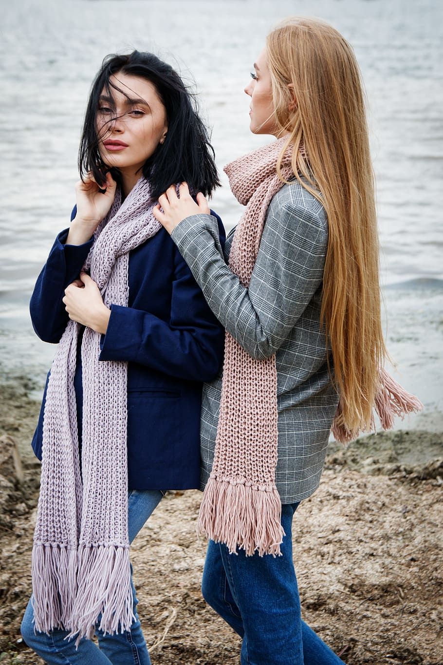 Two women wearing scarves