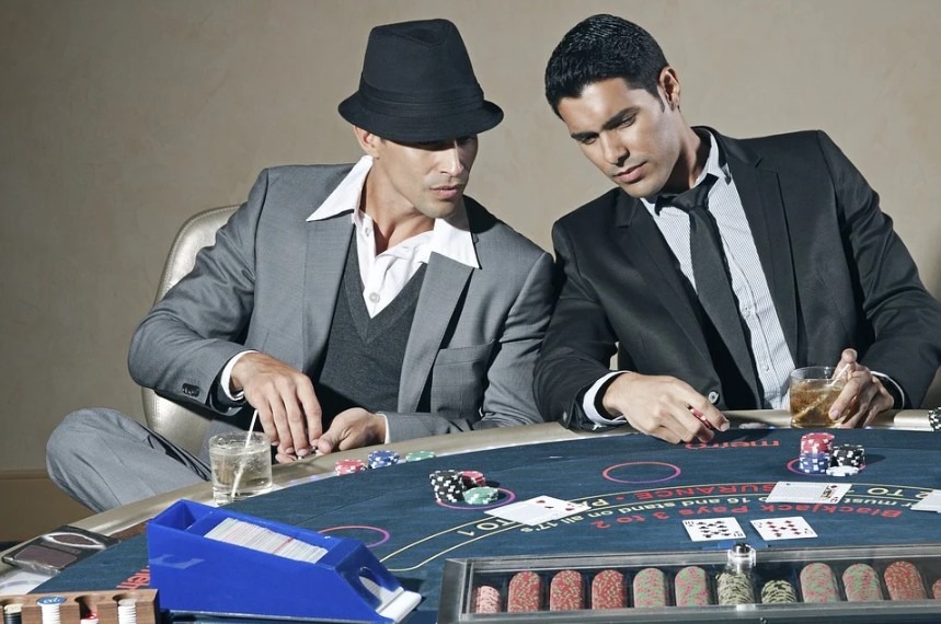 men in formal wear playing in a casino