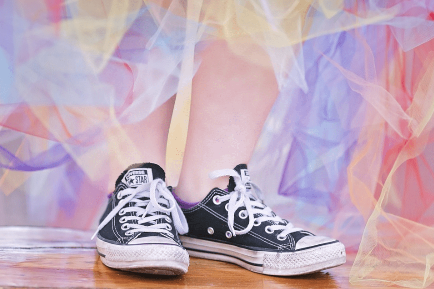person wearing a pair of Chuck Taylors
