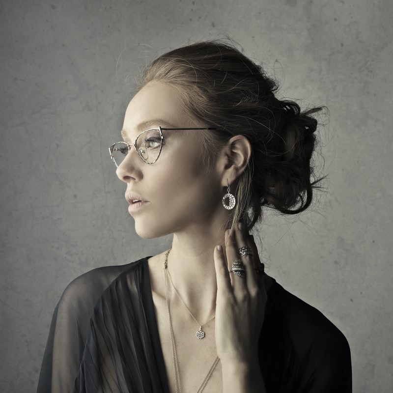 woman wearing silver jewelry pieces