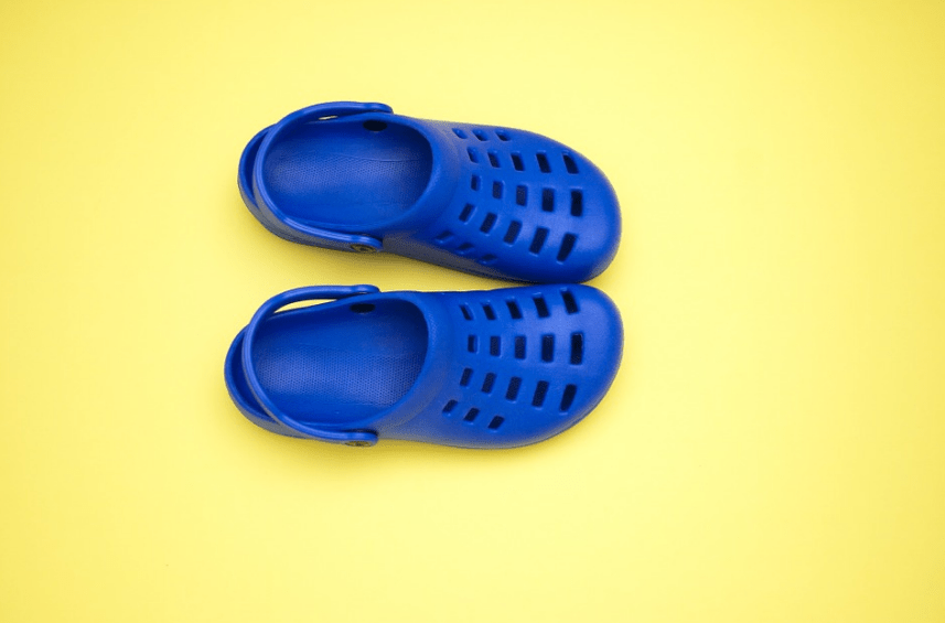 blue crocs, yellow background