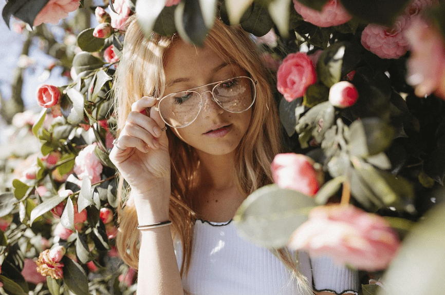 girl wearing eyeglasses, roses, leaves