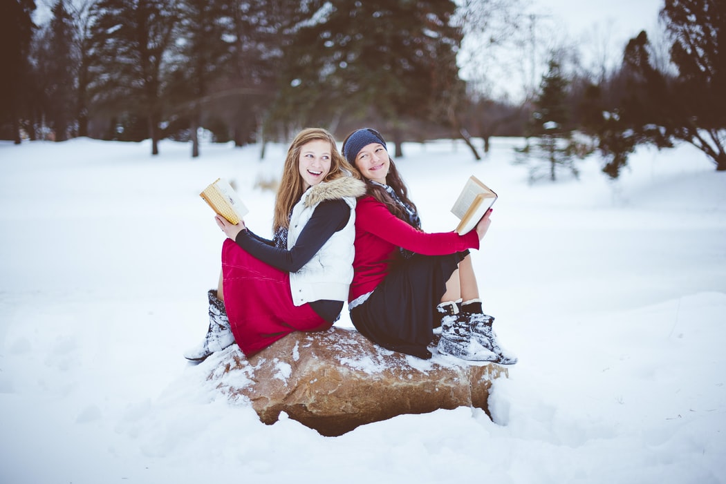 two women wearing skirts in winter