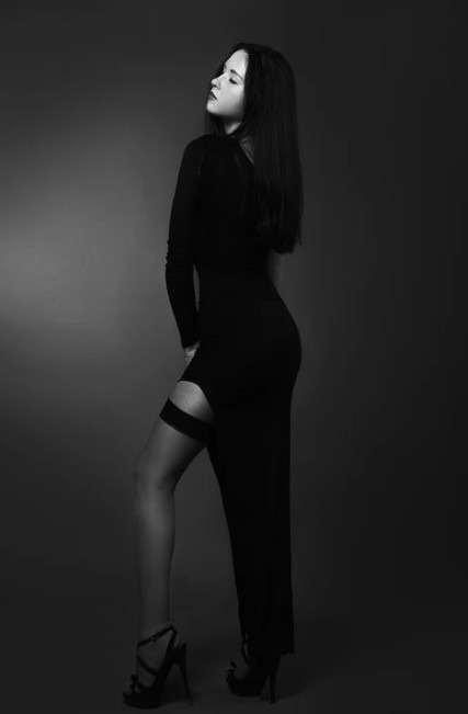 woman in black dress wearing stockings
