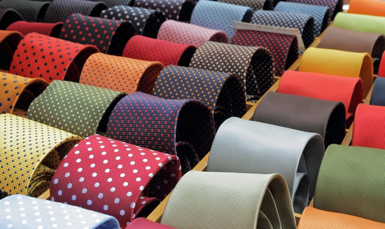 A display of wide and colorful neckties