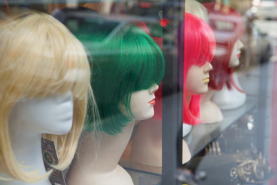 : wigs on display at a store