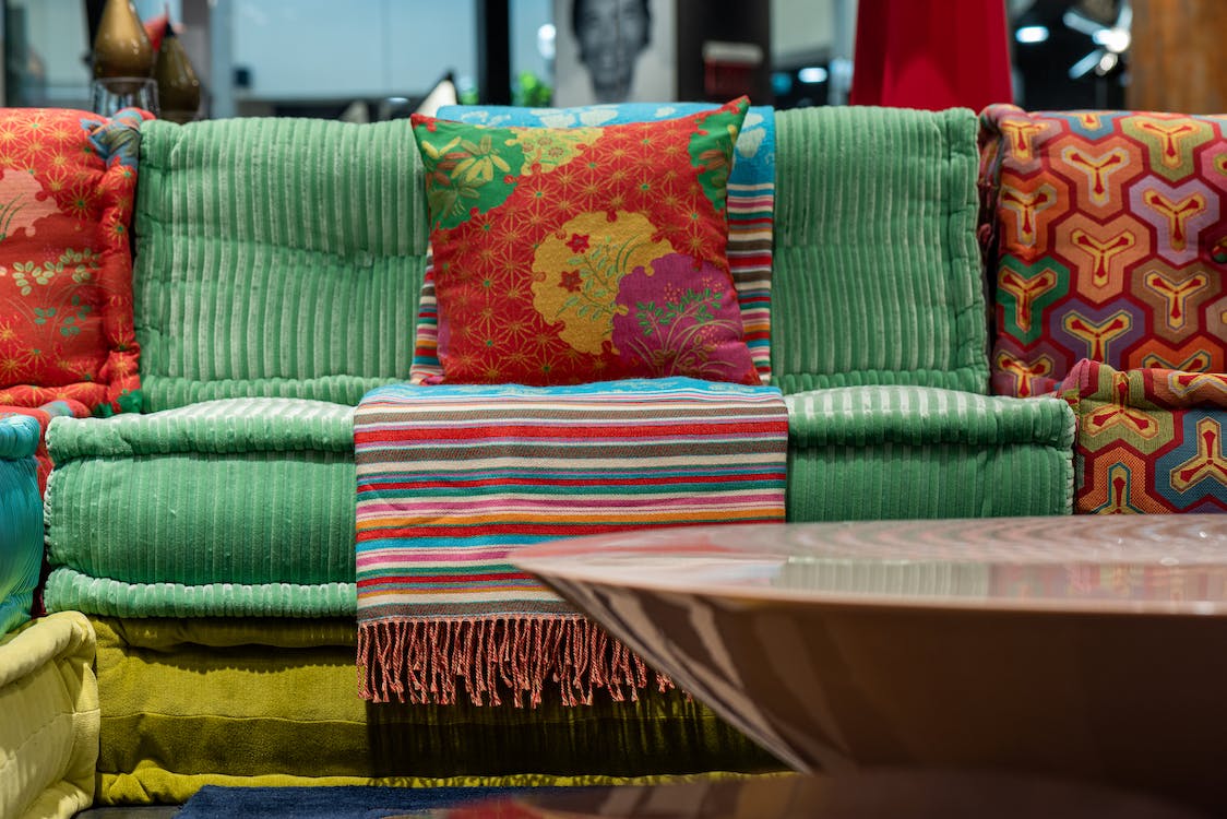 colorful sofa near the round table in flat