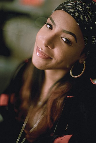 Aaliyah wearing a bandana and hoop earrings