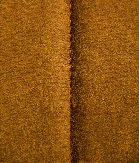 A close up of a yellow suede surface