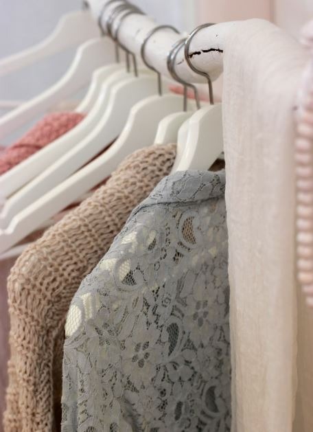Clothes hanging on white rack