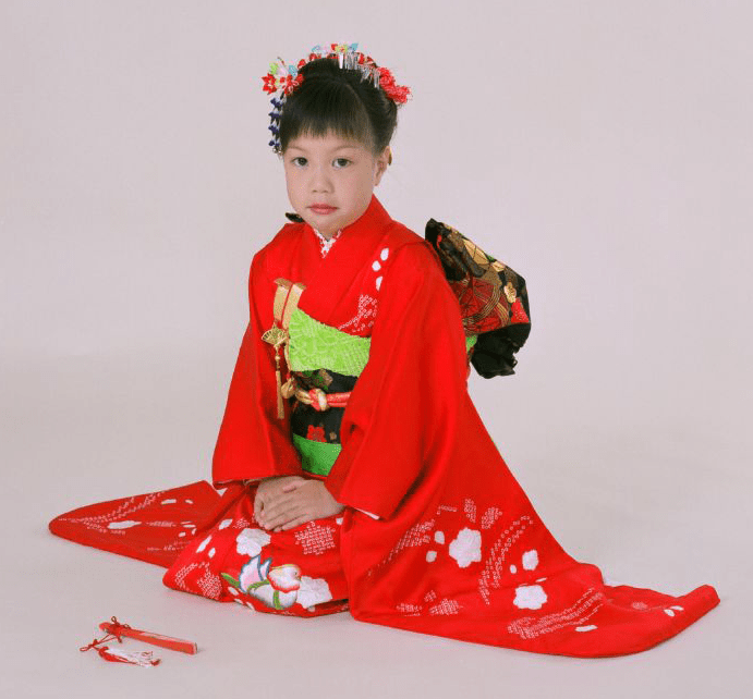 A child wearing a furisode kimono in full formal dress