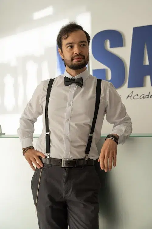 Man in Shirt with Bow Tie and Pants with Suspenders