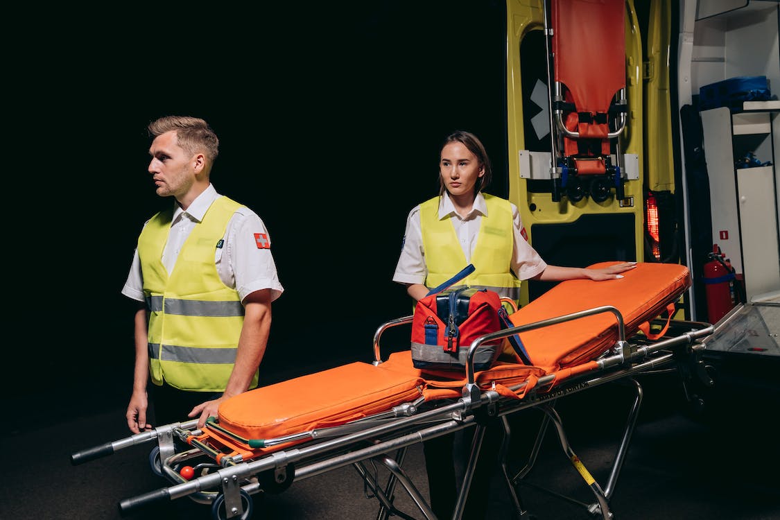 a male and female paramedic responding to an emergency