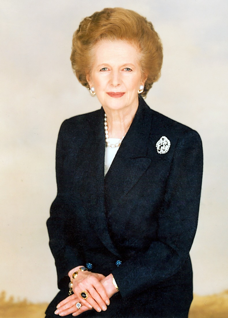 Margaret Thatcher wearing a typical power dressing outfit 