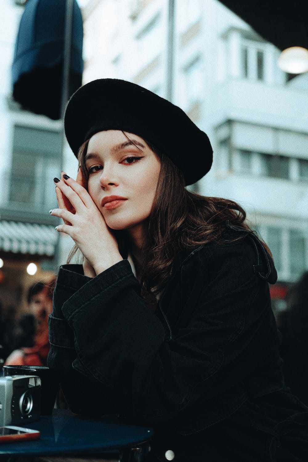 pretty brunette woman with a beret